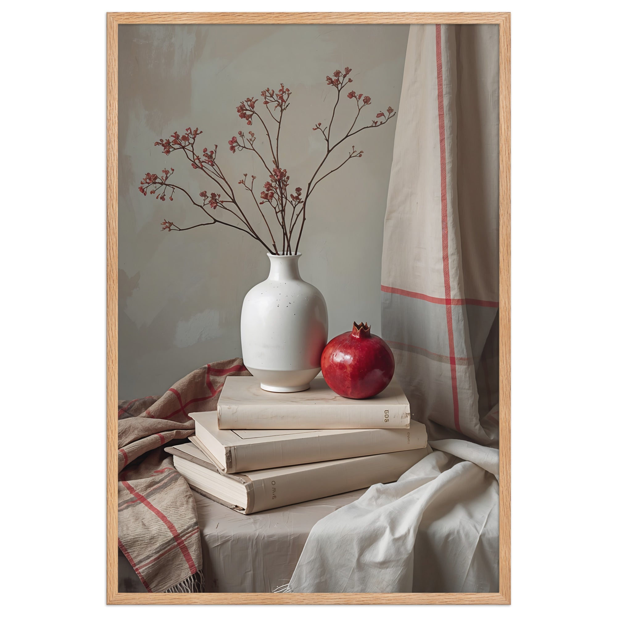 Still life wall art with pomegranate, white vase, and books in soft Scandinavian light.
