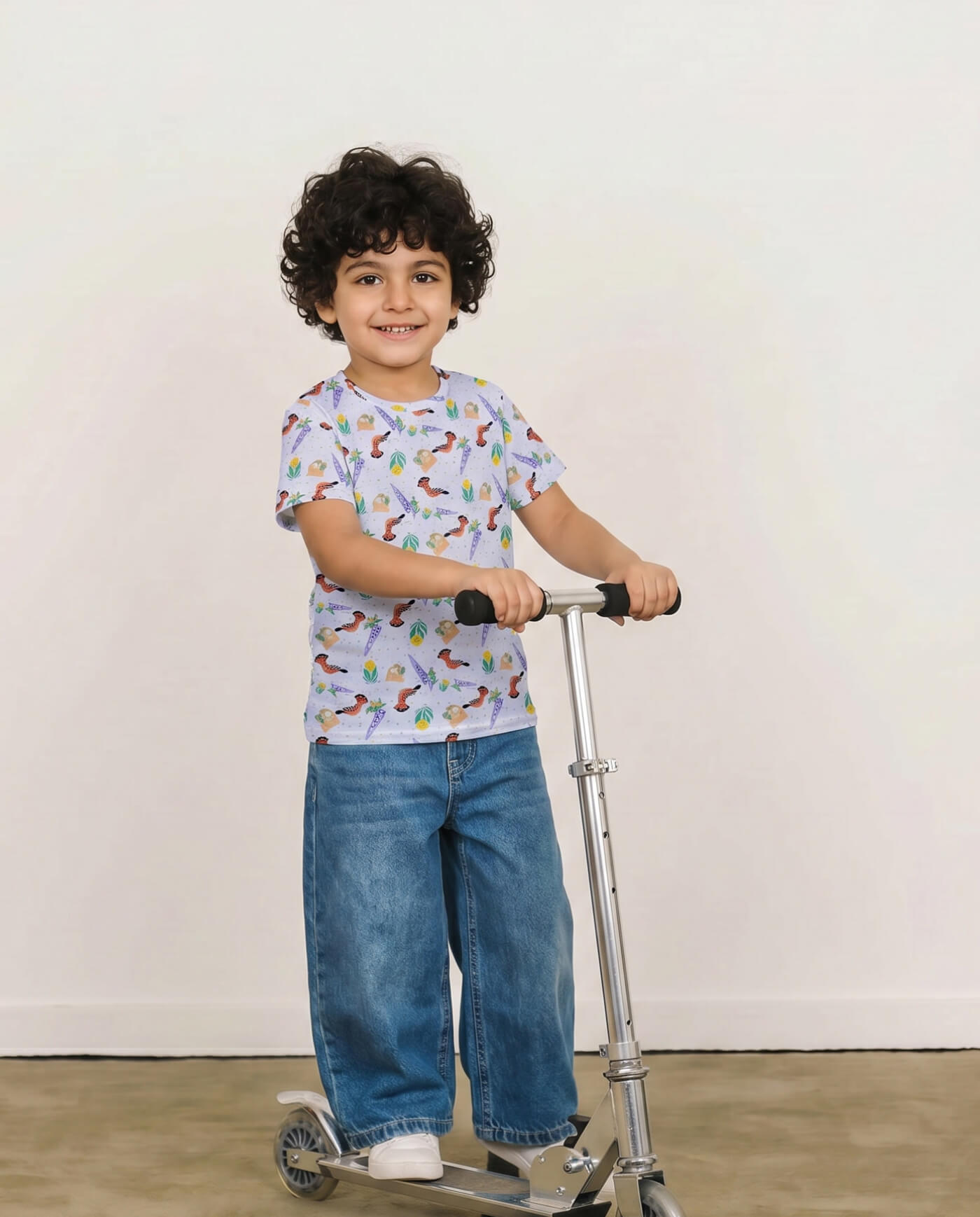 Child wearing a hoopoe bird kids t-shirt with soft lilac botanical and illustrated bird pattern.