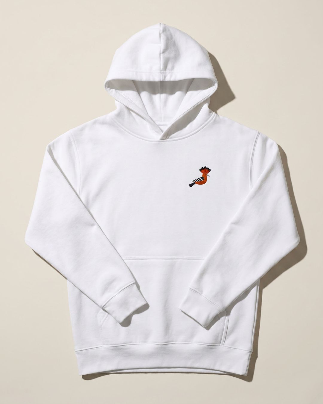 kids and youth's white hoodie flat lay with embroidered hoopoe bird detail