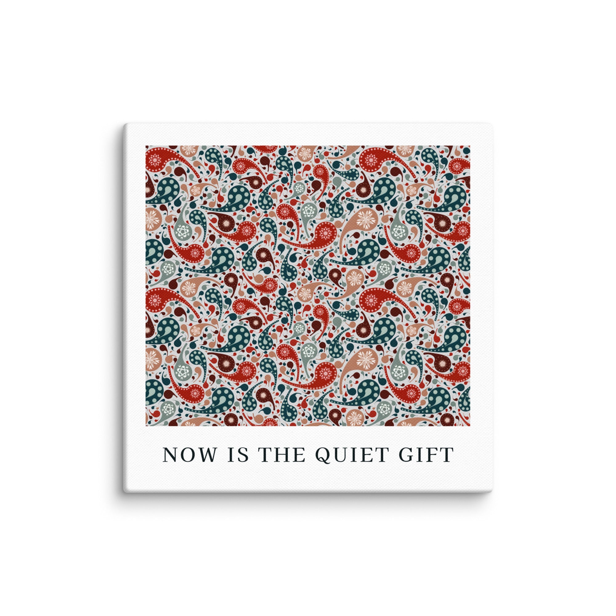 Square product with white border and colorful paisley pattern, featuring text 'NOW IS THE QUIET GIFT'