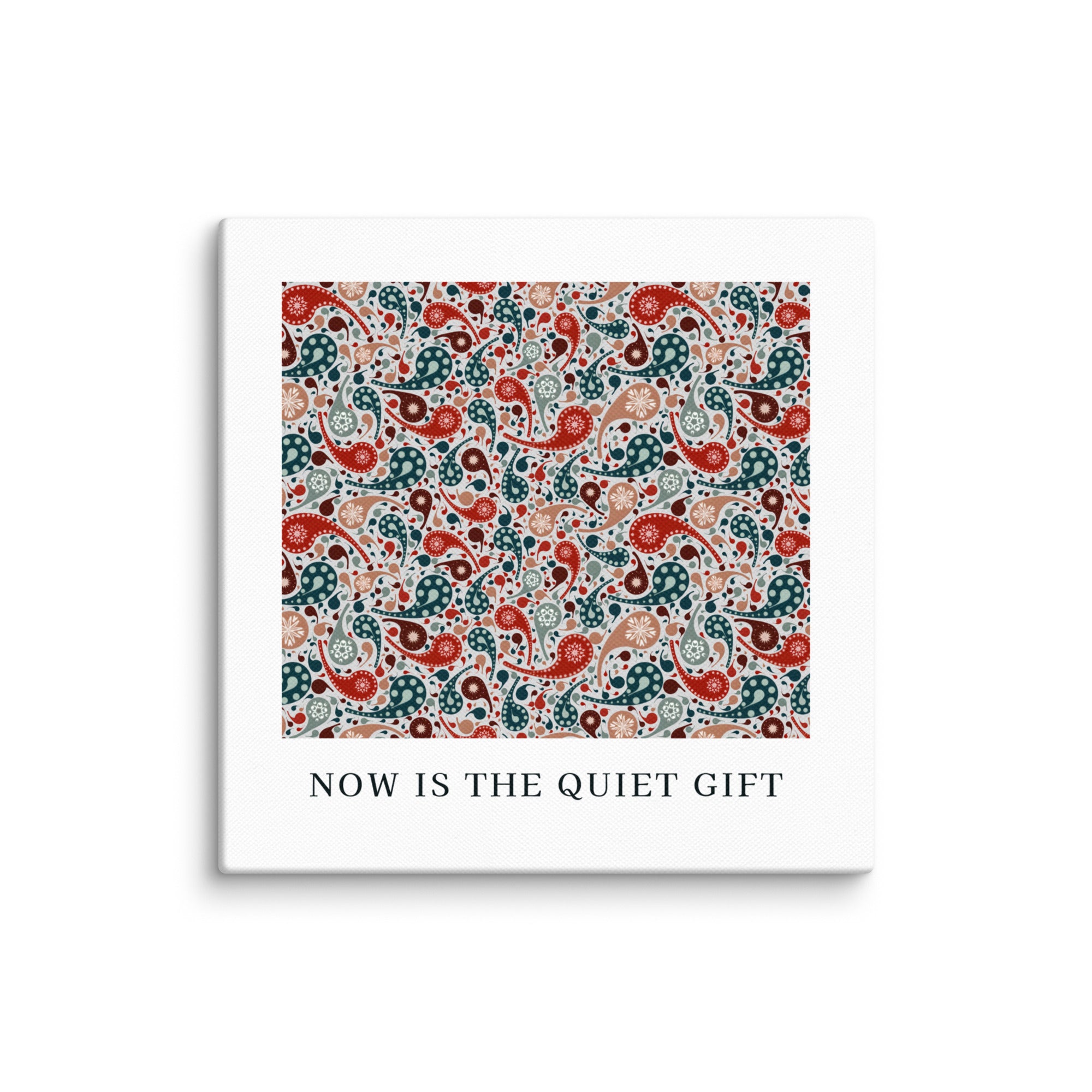 Square product with white border and colorful paisley pattern, featuring text 'NOW IS THE QUIET GIFT'