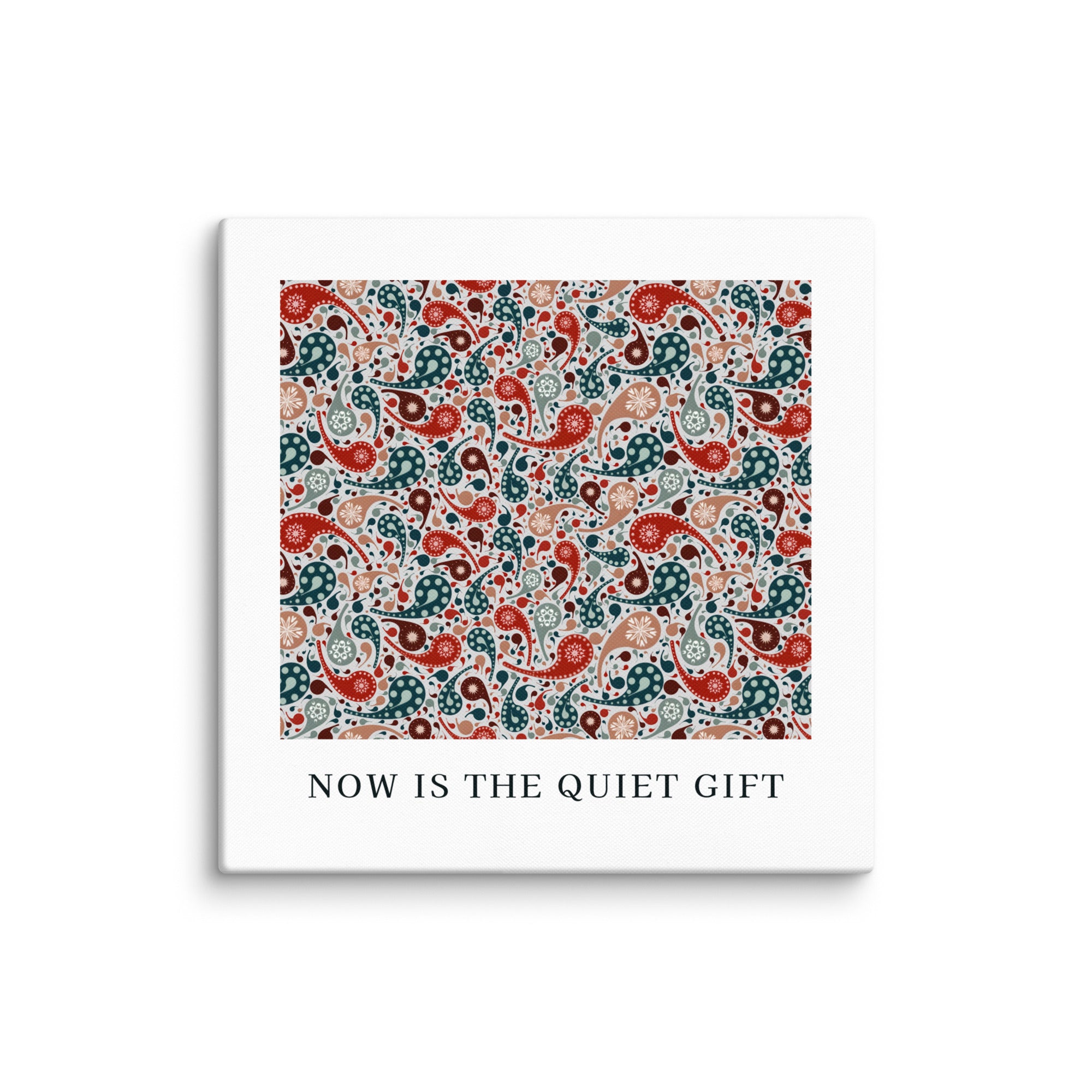 Square product with white border and colorful paisley pattern, featuring text 'NOW IS THE QUIET GIFT'