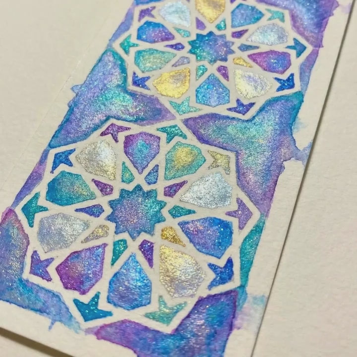 Short video showing the shimmer finish on a painted Islamic geometric bookmark made with the Deenista Islamic shimmer watercolor kit